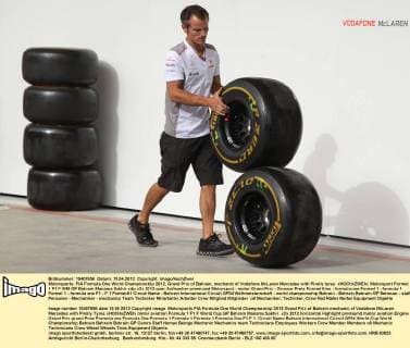 Motorsports: FIA Formula One World Championship 2012, Grand Prix of Bahrain, mechanic of Vodafone McLaren Mercedes with Pirelly tyres xHOCHxZWEIx