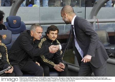 Barcelona s Josep Pep Guardiola and Real Madrid s Jose Mourinho during la Liga match on April 21st 2012.. In the middle is Rui Faria - FC Barcelona Barca vs Real Madrid  (103)