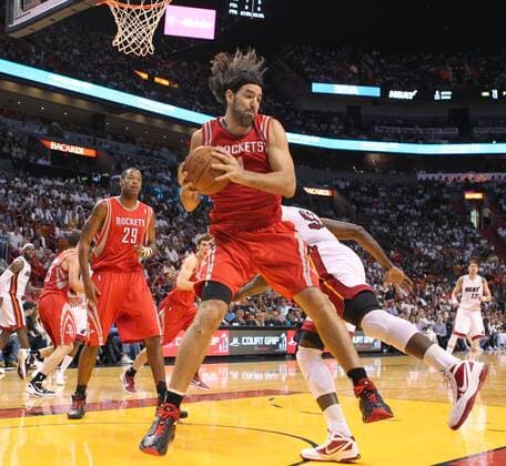 April 22, 2012 - Miami, FL, USA - The Houston Rockets Luis Scola grabs a rebound during the second quarter against the Miami Heat at AmericanAirlines Arena in Miami, Florida, on Sunday, April 22, 2012. The Heat turned away the Rockets, 97-88. Houston Rockets at Miami Heat - ZUMAm67