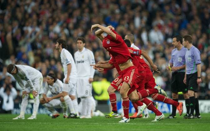 UEFA Champions League -- Real Madrid CF vs. FC Bayern München - FC Bayern Munchen s Mario Gomez leads the celebrations as his side knock-out Real Madrid on penalties to read the final during the UEFA Champions League SemiFinal 2nd Leg match at the Estadio Santiago Bernabeu. xHOCHxZWEIx xPropagandax 