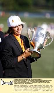 Ricky Fowler holds his trophy after winning theWells Fargo Championship at Quail Hollow Club in Charlotte, North Carolina on May 6, 2012. Fowler earned his first PGA Golf Herren Tour win.  CHP2012050697