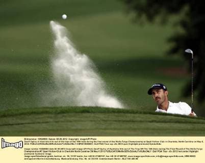 Geoff Ogilvy of Australia hits out of the trap on the 15th hole during the final round of the Wells Fargo Championship at Quail Hollow Club in Charlotte, North Carolina on May 6, 2012.  CHP2012050661