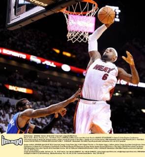 May 9, 2012 - Miami, Florida, U.S. - The Miami Heat s LEBRON JAMES dunks over New York Knicks AMAR E STOUDEMIRE in Game 5 of the Eastern Conference first-round series at American Airlines Arena. James scored 29 points in the Heat s 106-94 win to end the series. NBA Basketball Herren USA Playoffs 2012 - Heat Beat Knicks 106-94 - ZUMAm67