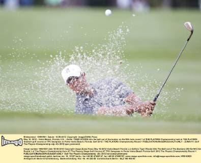 May 10, 2012 - Vedra Beach, Florida, U.S. - Golfer TIGER WOODS hits the ball out of the bunker on the10th hole round 1 of THE PLAYERS Championship held at THE PLAYERS Stadium golf course at TPC Sawgrass in Ponte Vedra Beach, Florida. Golf 2012 - THE PLAYERS Championship Round 1  - ZUMAr11