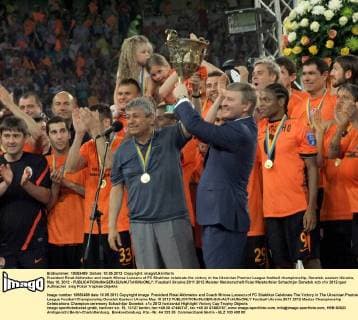 President Rinat Akhmetov and coach Mircea Lucescu of FC Shakhtar celebrate the victory in the Ukrainian Premier League football championship, Donetsk, eastern Ukraine, May 10, 2012 - 