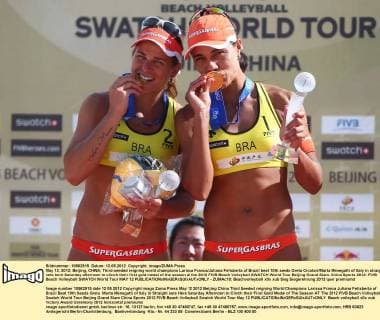 May 12, 2012; Beijing, CHINA; Third-seeded reigning world champions Larissa Franca Juliana Felisberta of Brazil beat 10th seeds Greta Cicolari Marta Menegatti of Italy in straight sets here Saturday afternoon to clinch their first gold medal of the season at the 2012 FIVB Beach Volleyball SWATCH World Tour Beijing Grand Slam. China Sports 2012: FIVB Beach Volleyball SWATCH World Tour MAY 12  - ZUMAc10