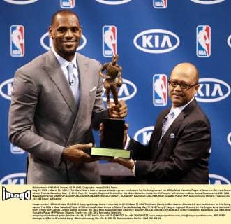 May 12, 2012 - Miami, FL, USA - The Miami Heat s Lebron James attends a press conference for his being named the NBA s Most Valuable Player at American Airlines Arena in Miami, Florida, Saturday, May 12, 2012. Percy D. Vaughn, Regional Director for Kia Motor America, holds the MVP trophy with James. LeBron James Receives his 2012 NBA Basketball Herren USA MVP Award - ZUMAm67