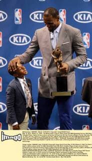 May 12, 2012 - Miami, FL, USA - The Miami Heat s Lebron James holds the NBA Basketball Herren USA Most Valuable Player trophy during a press conference at American Airlines Arena in Miami, Florida, Saturday, May 12, 2012. His son, Lebron Jr., stands on the left. LeBron James Receives his 2012 NBA Basketball Herren USA MVP Award - ZUMAm67
