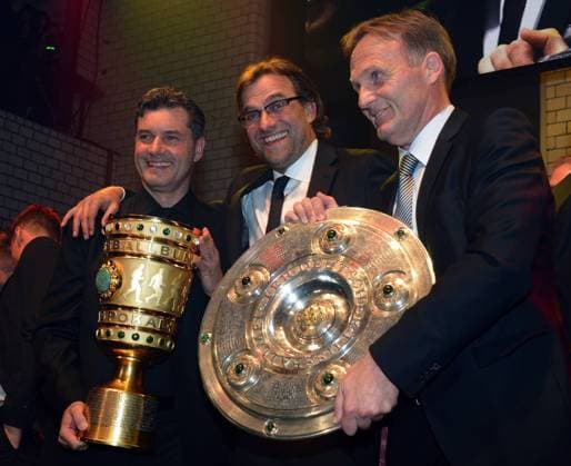 BERLIN, GERMANY - MAY 12: Head coach Juergen Klopp (C) celebrates with manager Michael Zorc (L) and managing director Hans Joachim Watzke (R) during the Borussia Dortmund party at the Ewerk on May 12, 2012 in Berlin, Germany. Local Caption Juergen Klopp; Michael Zorc; Hans Joachim Watzke