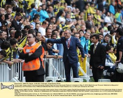 Turkey super league playoff championship group football match at Sukru Saracoglu Stadium in Istanbul on May 12, 2012. Match Scored: Pictured: Abdulrahim Albayrak of Galatasaray with Fenerbahce Fans. 