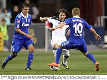 MAY 09 2012: Kai Herdling (38) of the Philadelphia Union tackles Lewis Holtby (10) of FC Schalke 04 (GER) during an international friendly match at PPL Park, in Chester, PA. Union won 2-1. SOCCER: MAY 09 MLS Fussball Herren USA - FC Schalke 04 at Philadelphia Union Icon2551205090504 EDITORIAL USE ONLY