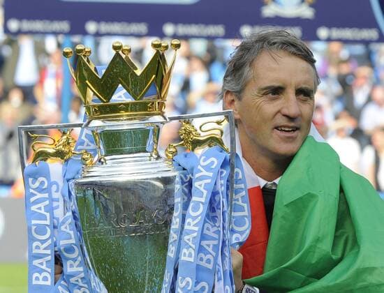 Roberto Mancini manager of Manchester City with the 2012 Barclays Premier League trophy .Barclays Premier League match Manchester City v QPR at the Etihad Stadium, Manchester on the 13th May 2012.Pic Simon Bellis SPORTIMAGE. EDITORIAL USE ONLY. No use with unauthorised audio, video, data, fixture lists, club league logos or live services. Online in-match use limited to 120 images, no video emulation. No use in betting, games or single club league player publications.