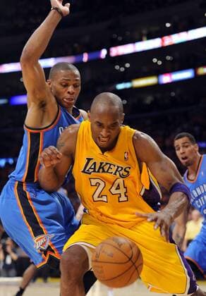 Los Angeles Lakers guard Kobe Bryant (24) is fouled by Oklahoma City Thunder point guard Russell Westbrook (0) during the second half of game 3 of the Western Conference Semifinals at Staples Center in Los Angeles on May 18, 2012. The Lakers won 99-96. UPI Lori Shepler  LAP20120518428