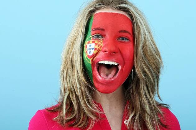 FUSSBALL - UEFA EURO 2012, Fotoshooting GRAZ,AUSTRIA,22.MAI.12 - FUSSBALL, Vorschau, Fotoshooting. Archivbild zeigt ein Model mit der portugiesischen Fahne als Gesichtsbemalung. Keywords: Bodypainting, Flagge, Portugal, Fan. - MODEL RELEASED - 
