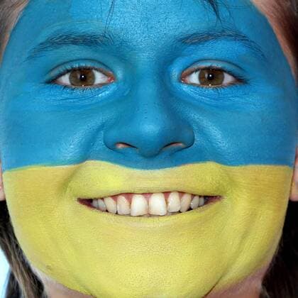 FUSSBALL - UEFA EURO 2012, Fotoshooting GRAZ,AUSTRIA,22.MAI.12 - FUSSBALL, Vorschau, Fotoshooting. Archivbild zeigt ein Model mit der ukrainischen Fahne als Gesichtsbemalung. Keywords: Bodypainting, Flagge, Ukraine, Fan. - MODEL RELEASED - 