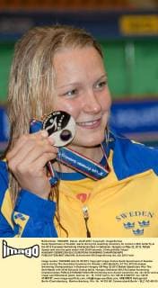 Sarah Sjoestroem of Sweden reacts during the awarding ceremony for women s 50m butterfly at the 2012 European Swimming Championships in Debrecen, Hungary on May 22, 2012. Rafael Sjoestroem won the gold medal with 25.64 seconds. (Xinhua Attila Volgyi) HUNGARY-DEBRECEN-2012 EUROPEAN SWIMMING CHAMPIONSHIPS 