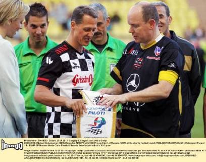 22.05.2012- Michael Schumacher (GER) Mercedes AMG F1 with HSH Prince Albert of Monaco (MON) at the charity football match 