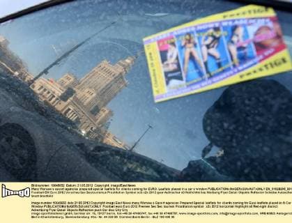 Many Warsaw s escort agencies prepared special leaflets for clients coming for EURO. Leaflets placed in a car s window  EN_01028265_0014