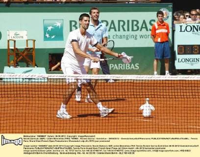 Novak Djokovic (SER) Julien Benneteau (FRA) TENNIS : Roland Garros - Exhibition - 26 05 2012 - GwendolineLeGoff Panoramic 