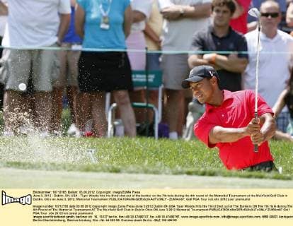 June 3, 2012 - Dublin, OH, USA - Tiger Woods hits his third shot out of the bunker on the 7th hole during the 4th round of the Memorial Tournament at the Muirfield Golf Club in Dublin, Ohio on June 3, 2012. Memorial Tournament - ZUMAm67