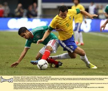 3 June 2012 - Mexico defender Severo Meza ( 13) and Brazil forward Leandro Damaio ( 9) battle for possession during the International Soccer friendly between Brazil and Mexico at Cowboys Stadium in Arlington, Texas. Mexico won 2-0. SOCCER: JUN 03 Brazil v Mexico Icon12060309 EDITORIAL USE ONLY