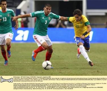 3 June 2012 - Brazil forward Neymar da Silva ( 11) and Mexico defender Carlos Salcido ( 3) battle for the ball during the International Soccer friendly between Brazil and Mexico at Cowboys Stadium in Arlington, Texas. Mexico won 2-0. SOCCER: JUN 03 Brazil v Mexico Icon12060310 EDITORIAL USE ONLY