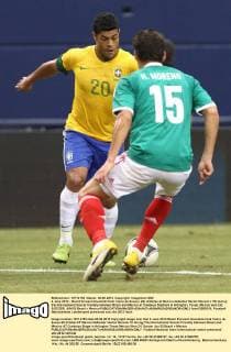 3 June 2012 - Brazil forward Givanildo Hulk Vieira de Souza ( 20) dribbles at Mexico defender Hector Moreno ( 15) during the International Soccer friendly between Brazil and Mexico at Cowboys Stadium in Arlington, Texas. Mexico won 2-0. SOCCER: JUN 03 Brazil v Mexico Icon12060319 EDITORIAL USE ONLY