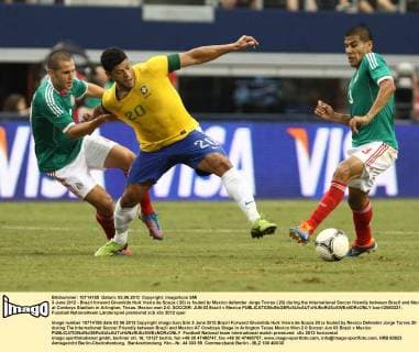 3 June 2012 - Brazil forward Givanildo Hulk Vieira de Souza ( 20) is fouled by Mexico defender Jorge Torres ( 20) during the International Soccer friendly between Brazil and Mexico at Cowboys Stadium in Arlington, Texas. Mexico won 2-0. SOCCER: JUN 03 Brazil v Mexico Icon12060321 EDITORIAL USE ONLY