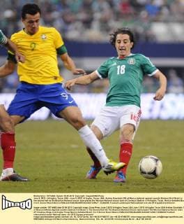 June 3, 2012 - Arlington, Texas, USA - June 3, 2012. Arlington, Texas, USA. Andres Guardado (18) of Mexico defends against Leandro Damiao (9) of Brazil in the second half as the Brazilian National soccer team played the Mexican National soccer team at Cowboys Stadium in Arlington, Texas. Mexico defeated Brazil 2 to 0. Soccer Brazil Mexico - ZUMAl92