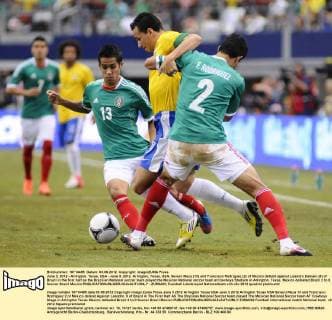 June 3, 2012 - Arlington, Texas, USA - June 3, 2012. Arlington, Texas, USA. Severo Meza (13) and Francisco Rodriguez (2) of Mexico defend against Leandro Damaio (9) of Brazil in the first half as the Brazilian National soccer team played the Mexican National soccer team at Cowboys Stadium in Arlington, Texas. Mexico defeated Brazil 2 to 0. Soccer Brazil Mexico - ZUMAl92