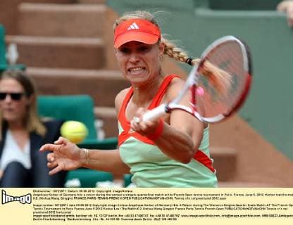 Angelique Kerber of Germany hits a return during the women s singels quarterfinal match at the French Open tennis tournament in Paris, France, June 5, 2012. Kerber lost the match 0-2. (Xinhua Wang Qingqin) FRANCE-PARIS-TENNIS-FRENCH OPEN 
