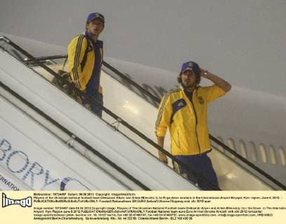 Players of the Ukrainian national football team Oleksandr Aliyev and Artem Milevskiy (L to R) go down airstairs in the International Airport Biryspil, Kyiv region, June 6, 2012. - 
