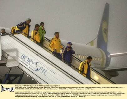 Head coach of the Ukrainian national football team Oleh Blokhin, his assistants and players go down airstairs in the International Airport Biryspil, Kyiv region, June 6, 2012. - 