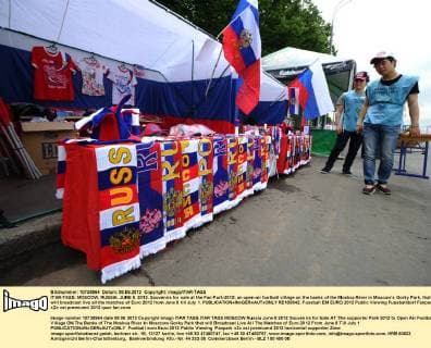 ITAR-TASS: MOSCOW, RUSSIA. JUNE 8, 2012. Souvenirs for sale at the Fan Park-2012, an open-air football village on the banks of the Moskva River in Moscowâ€™s Gorky Park, that will broadcast live all the matches of Euro 2012 from June 8 till July 1.  RE100842