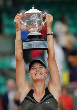 PARIS, June 9, 2012 -- Maria Sharapova of Russia holds the trophy during the awarding ceremony of the women s singles at the French Open tennis tournament in Paris, France, June 9, 2012. 