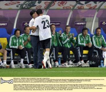 Joachim Loew (Front L), head coach of Germany hugs Mario Gomes of Germany during the Group B match against Portugal at the Euro 2012 football championships in Lviv, Ukraine, June 9, 2012. Germany won 1-0. (Xinhua Ma Ning) (jyc) UKRAINE-LVIV-EURO 2012 FOOTBALL CHAMPIONSHIPS-GERMANY VS PORTUGAL 