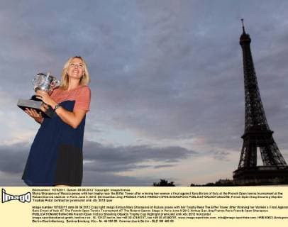 Maria Sharapova of Russia poses with her trophy near the Eiffel Tower after winning her women s final against Sara Errani of Italy at the French Open tennis tournament at the Roland Garros stadium in Paris June 9, 2012. (Xinhua Gao Jing) FRANCE-PARIS-FRENCH OPEN-SHARAPOVA 