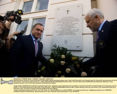 Representatives of Russia s team laid flowers at the plaque commemorating the plane crash, which killed President Lech Kaczynski and his wife and 96 representatives of the Polish Government - Head Coach Dick Advocaat (L) - CHAD_100612 