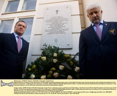 Representatives of Russia s team laid flowers at the plaque commemorating the plane crash, which killed President Lech Kaczynski and his wife and 96 representatives of the Polish Government - Head Coach Dick Advocaat (L) CHAD_100612 