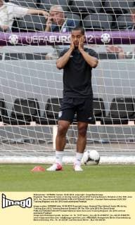 Englands Theo Walcott looks on during training..Euro 2012 Training Session, Donetsk on the 10th June 2012. Pic David Klein SPORTIMAGE EDITORIAL USE ONLY. No use with unauthorised audio, video, data, fixture lists, club league logos or live services. Online in-match use limited to 120 images, no video emulation. No use in betting, games or single club league player publications.