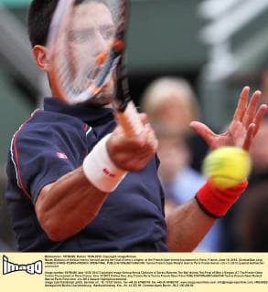 Novak Djokovic of Serbia returns the ball during the final of men s singles at the French Open tennis tournament in Paris, France, June 10, 2012. (Xinhua Gao Jing) FRANCE-PARIS-TENNIS-FRENCH OPEN-FINAL 