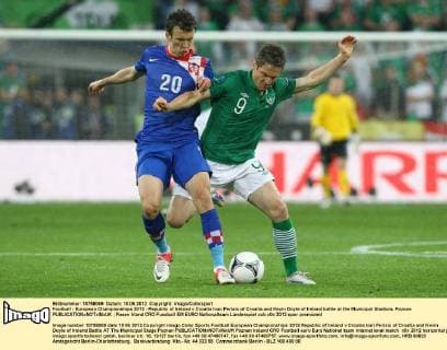 Football - European Championships 2012 - Republic of Ireland v Croatia Ivan Perisic of Croatia and Kevin Doyle of Ireland battle at the Municipal Stadium, Poznan 