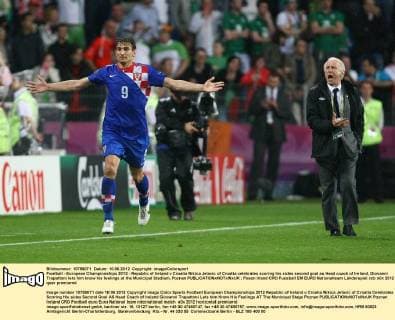 Football - European Championships 2012 - Republic of Ireland v Croatia Nikica Jelavic of Croatia celebrates scoring his sides second goal as Head coach of Ireland, Giovanni Trapattoni lets him know his feelings at the Municipal Stadium, Poznan 