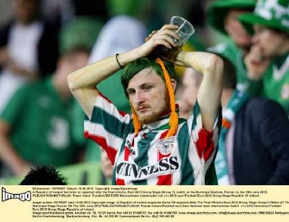 A Republic of Ireland fan looks on dejected after the final whistle..Euro 2012 Group Stage (Group C) match, at the Municipal Stadium, Poznan on the 10th June 2012. EDITORIAL USE ONLY. No use with unauthorised audio, video, data, fixture lists, club league logos or live services. Online in-match use limited to 120 images, no video emulation. No use in betting, games or single club league player publications.