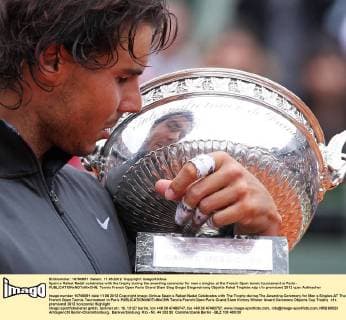 Spain s Rafael Nadal celebrates with the trophy during the awarding ceremony for men s singles at the French Open tennis tournament in Paris - 