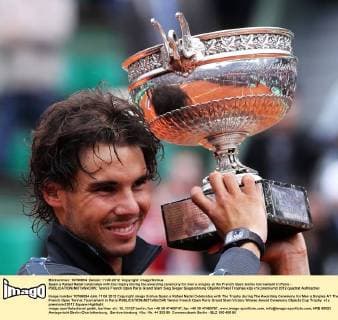 Spain s Rafael Nadal celebrates with the trophy during the awarding ceremony for men s singles at the French Open tennis tournament in Paris - 
