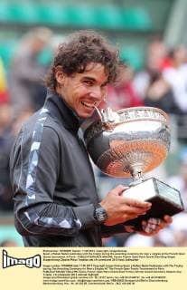 Spain s Rafael Nadal celebrates with the trophy during the awarding ceremony for men s singles at the French Open tennis tournament in Paris - 