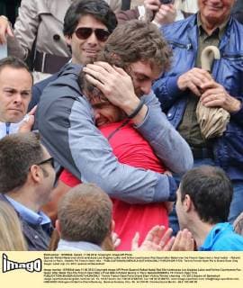 Spanish Rafael Nadal (red shirt) embraces Los Angeles Laker and fellow countryman Pau Gasol after Nadal won his French Open men s final match - Roland Garros in Paris - Nadals 7th French Open title -  PAR20120611722