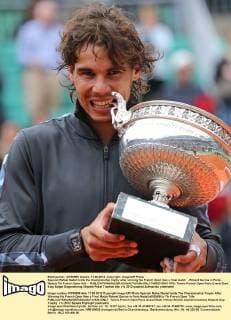 Spanish Rafael Nadal holds the championship trophy after winning his French Open men s final match - Roland Garros in Paris - Nadals 7th French Open title -  PAR20120611709