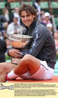 Spanish Rafael Nadal holds the championship trophy after winning his French Open men s final match - Roland Garros in Paris - Nadals 7th French Open title -  PAR20120611710